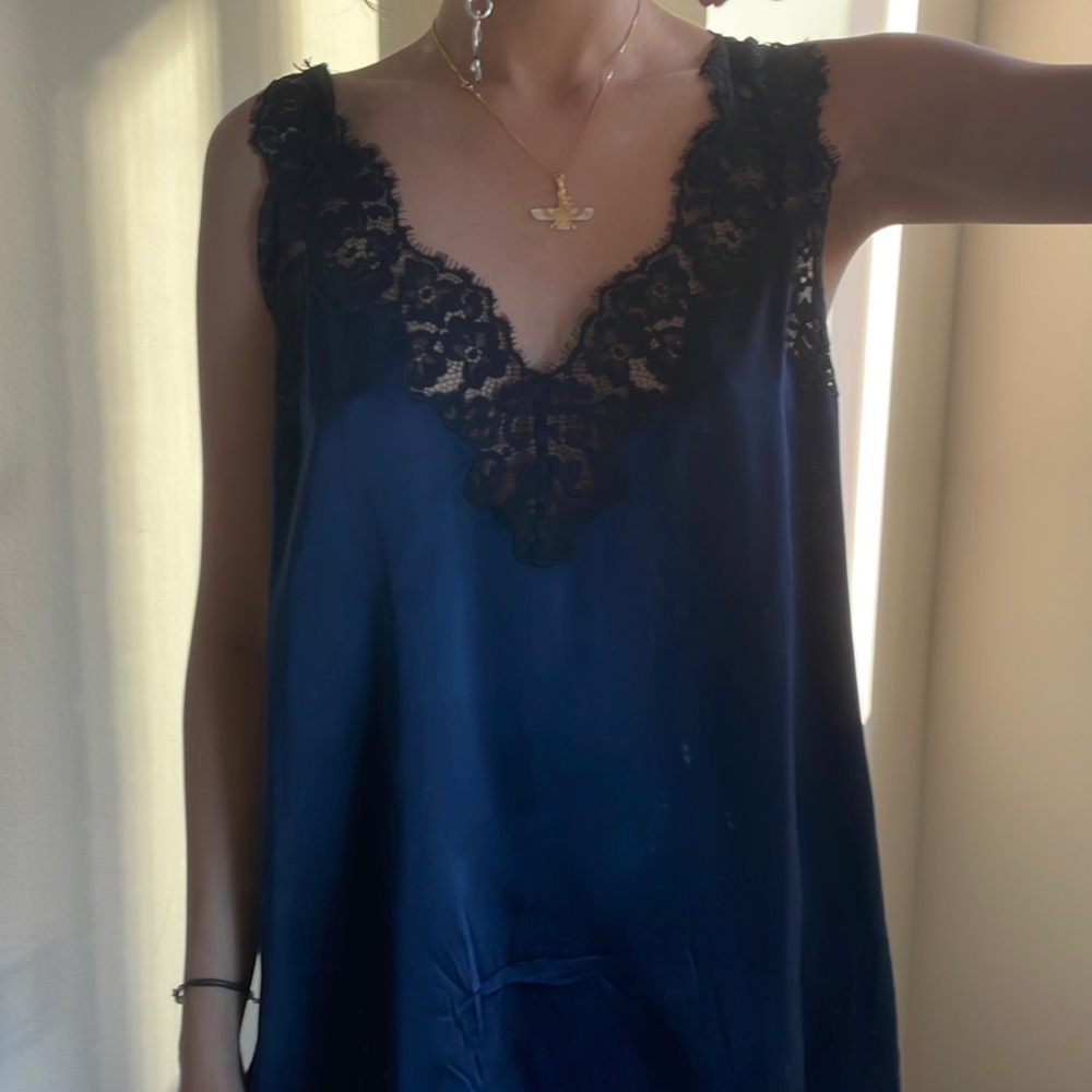 Silk top with lace details.